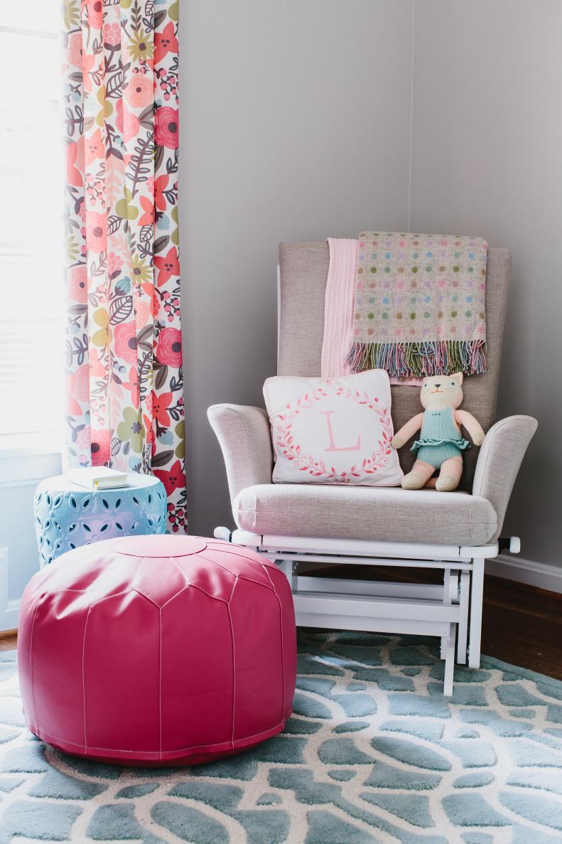 Transitional Nursery With Gray Glider, Hot Pink Pouf & Floral Curtains