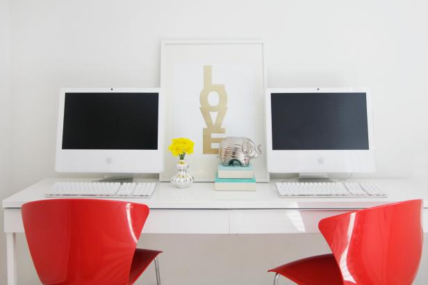 Modern White Office With White Desk, Neutral Art and Red Chairs