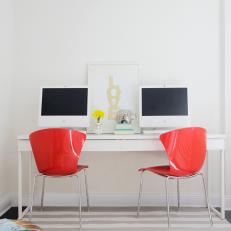 Modern White Home Office With Bold Red Desk Chairs