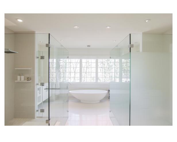 Sculpted Limestone Bathtub in White Modern Spa Bathroom