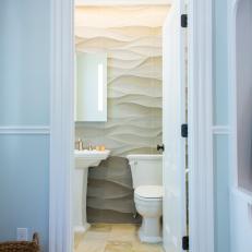 Neutral Transitional Powder Room With Carved Stone Tile Wall