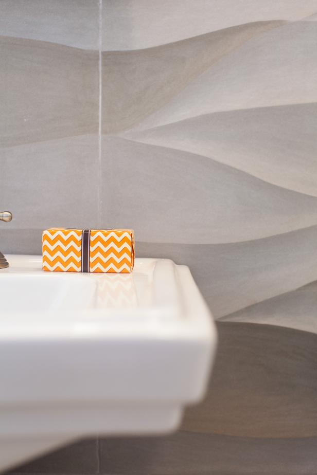 Wavy Stone Tile Wall in Neutral Transitional Powder Room | HGTV