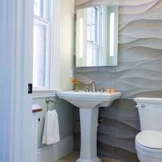 Neutral Transitional Powder Room With Wavy Stone Accent Wall