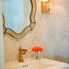 Neutral Traditional Powder Room With Gold-Framed Mirror