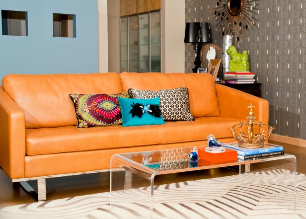 Orange Leather Sofa and Colorful Accessories in Eclectic Living Space