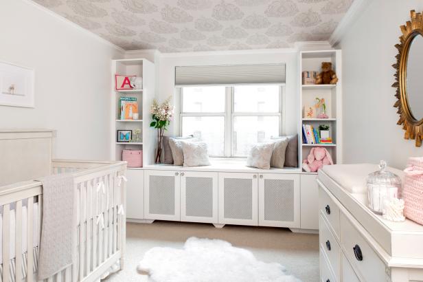 Neutral Nursery With White Built-In Storage and Gray Patterned Ceiling