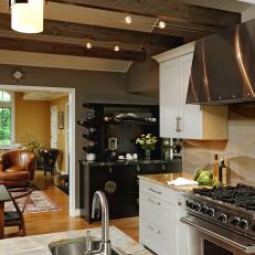Contemporary Eat-in Kitchen With Exposed Beams, Stainless Hood