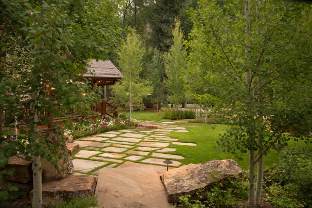 Stone Pavers in Lush Lawn With Surrounding Trees