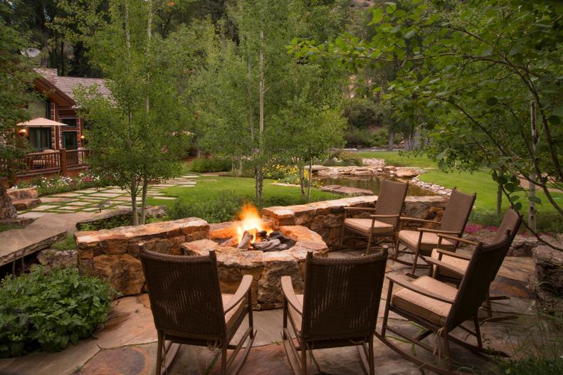 Rocking Chairs Circle Up Around Rugged Fire Pit