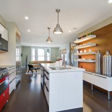 Neutral Modern Kitchen With Red Oven, White Island and Wood Wall