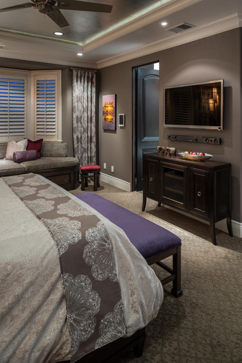 Neutral Transitional Bedroom With Luxe Fabrics and Purple Bench