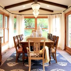 Traditional Dining Room With Beamed Ceiling and Alfresco Feel