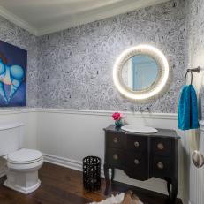 Eclectic Powder Room With Striking Wallpaper