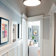 Neutral Transitional Hallway With White Wainscoting