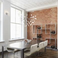 Modern White Dining Room With Exposed Brick Wall