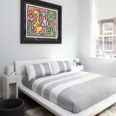 Colorful Modern Art Forms Focal Point in Neutral Bedroom