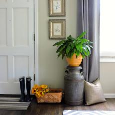 Neutral Contemporary Entryway With Metal Urn and Yellow Flower Pot