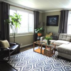 Neutral Contemporary Living Space With Sectional and Blue Graphic Rug