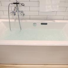 Contemporary Soaker Tub With Stainless Steel Fixtures