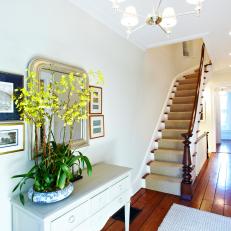 White Traditional Foyer With Yellow Orchid