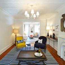 Stylish Living Room Features Mustard Yellow Chair & Navy Accents
