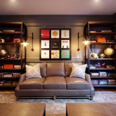 Neutral Transitional Library With Wood-Paneled Walls