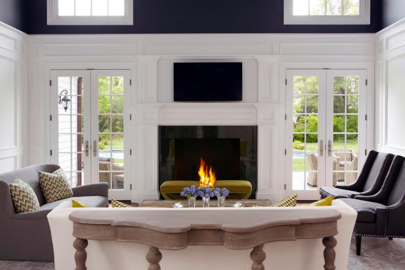 Family Room With French Doors, White Mantel and Whitewashed Console