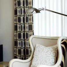 Neutral Reading Nook With Zebra-Patterned Armchair