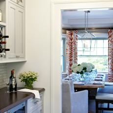 Neutral Transitional Butler's Pantry With View of Dining Room 