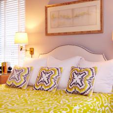 Lavender Master Bedroom Boasts Vibrant Yellow Bedding