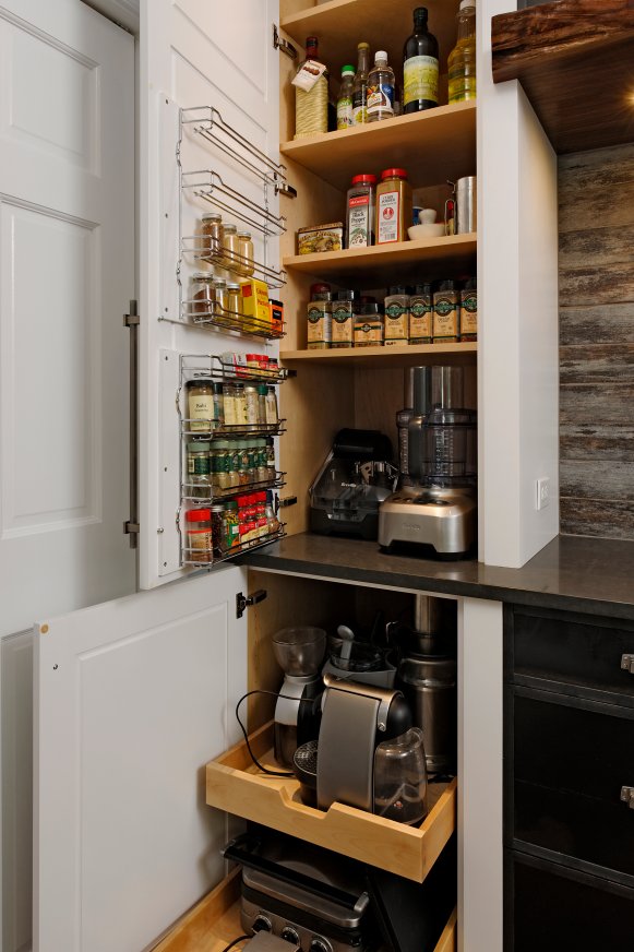 Hidden White Storage Cabinets in Rustic Kitchen