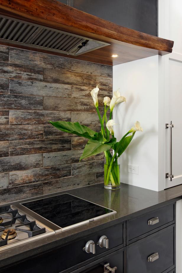 Modern Kitchen With Rustic Tile Backsplash and Live-Edge Walnut Hood