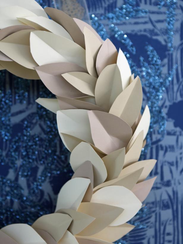 A take on the classic magnolia wreaths often seen during the holiday season, this easy-to-make paper version is neutral enough to display all season long.