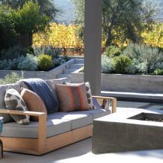 Contemporary Stone Patio With Outdoor Wood Seating