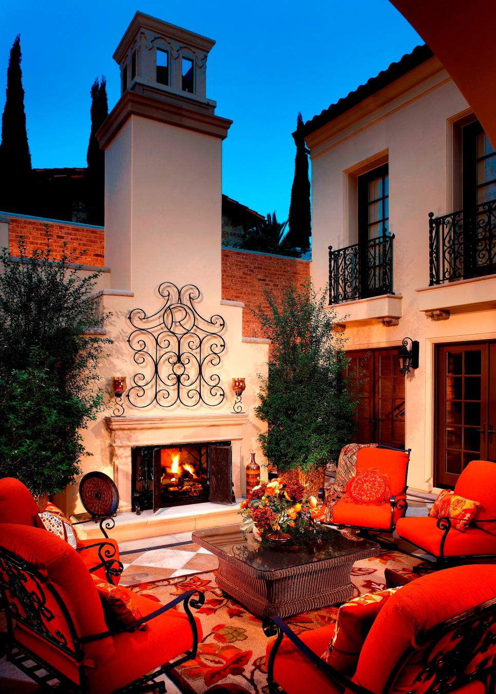 Mediterranean Outdoor Sitting Area With Stucco Fireplace | HGTV