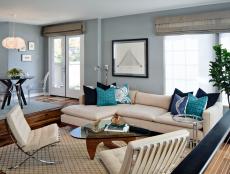 Blue Contemporary Living Space With Neutral Furniture and Blue Pillows