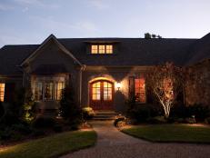 Stone Home Exterior and Flagstone Walkway at Night