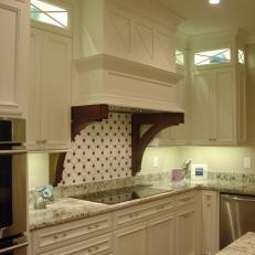 Traditional Range Hood With Custom Corbels & Decorative Backsplash