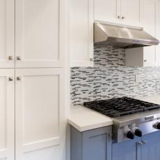 Blue and White Kitchen Cabinets and Mosaic Tile Backsplash