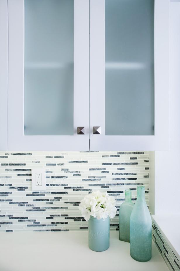 White Kitchen Cabinets And Glass Bottles Hgtv