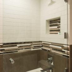 Sleek and Stylish Shower and Bath Area With Niche