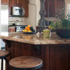 Traditional Kitchen Island With Barstools and Granite Countertop