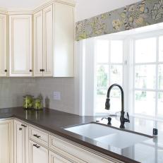 Cottage Kitchen With Bay Windows and Custom Glazed Cabinets