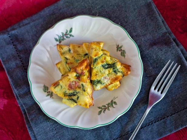 Make spinach frittatas in a Christmas tree shape as a festive, easy holiday breakfast idea for guests.