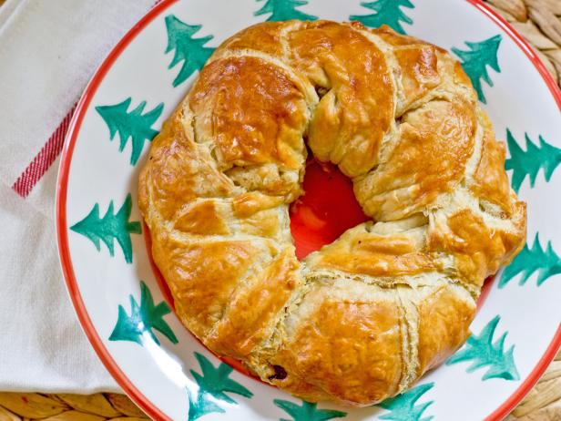 Fill pastry dough with cheese and herbs, and form it into a circle to create a holiday-inspired breakfast for overnight guests.