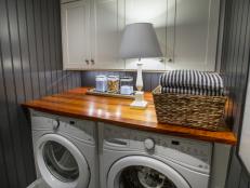 Stylish and functional, this laundry room and powder room duo features cool gray and white hues, charming beadboard and luxury hardware.