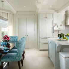 Tropical Kitchen and Dining Area With Aqua Chairs