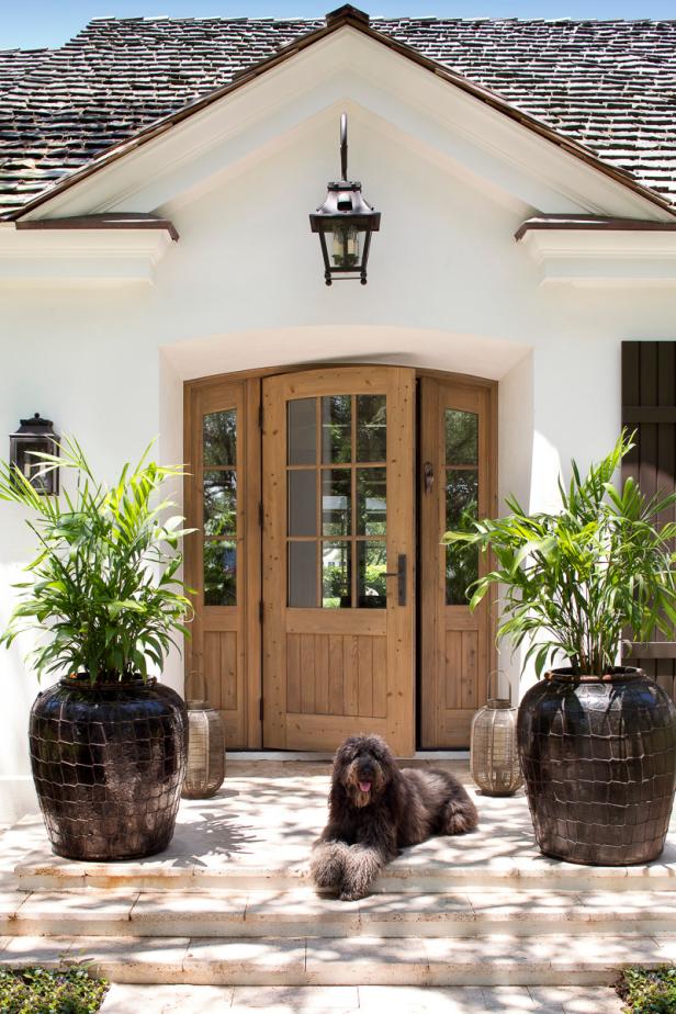 White Beach House Entrance With Wood Front Door