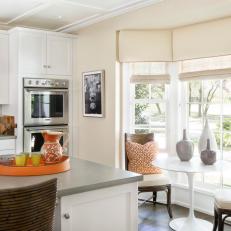 Tropical Eat-In Kitchen With Bright Pops of Orange