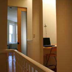 Sleek, Neutral Hallway With Home Office Nook